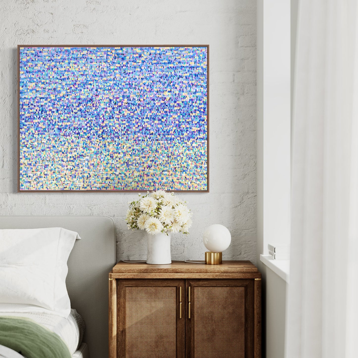 Framed colourful abstract art hanging on wall by Anouska Healy